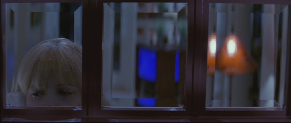 On a side note, this is called a "Closed Frame." Notice how in the picture the windows are boxing in Casey. This is used to imply that she that she is trapped by the circumstance of the scene.