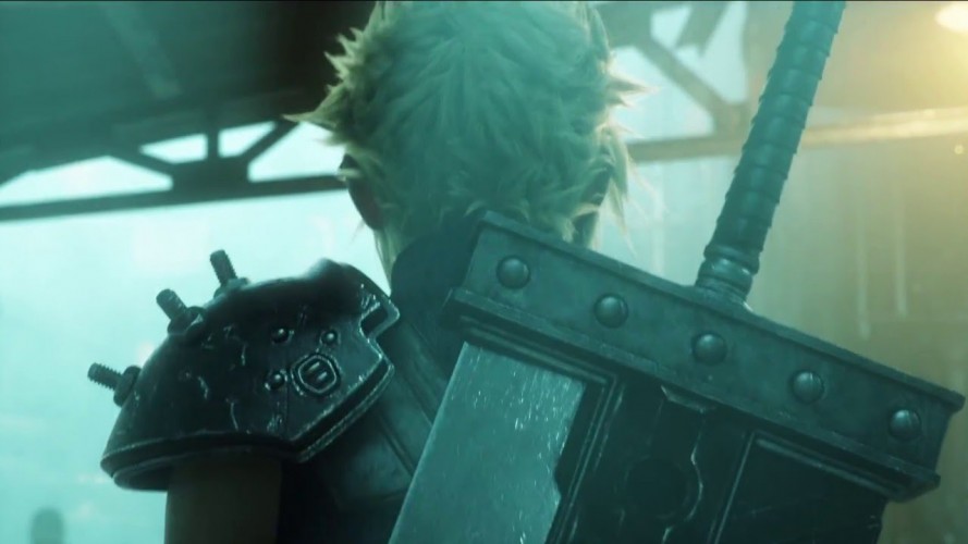 New screenshot of Final Fantasy VII Remake. Spiky blond-haired protagonist Cloud has his back turned, showing off the enormous buster sword strapped to his back while walking through a murky, crowded Midgar market.